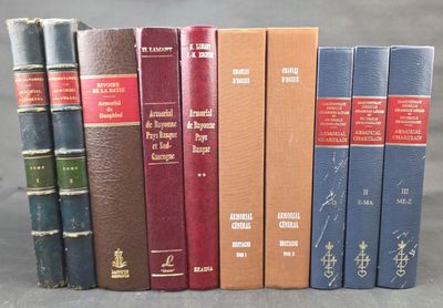 several books are lined up in a row on a table