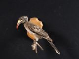 a bird that is sitting on top of a piece of wood