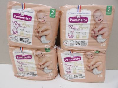 four packs of baby diapers sitting on top of each other