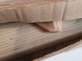 a piece of wood that is sitting on top of a piece of wood