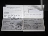 two papers that are sitting on a table