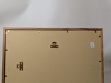 two pieces of wood are sitting next to each other on a white surface