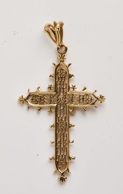 une croix dorée sur fond blanc