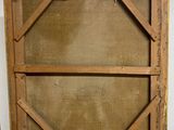 an old wooden frame with a window on top of it