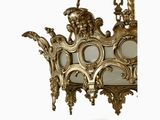 a gold chandelier hanging from the ceiling
