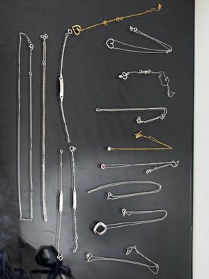 a picture of a blackboard with a bunch of necklaces on it