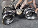 a lot of old binoculars that are on the table
