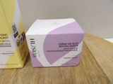 a box of cream next to a box of cream on a table