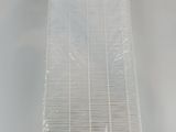 a close up of a white air filter on a table