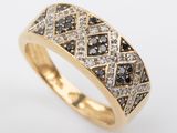 a yellow gold ring with black and white diamonds