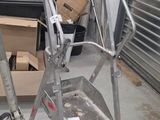 a ladder that is leaning against a wall in a garage