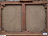 an old wooden easel with a piece of paper on top of it