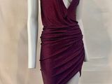 the mannequin is wearing a red dress with a deep v neckline
