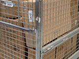 a metal cage with boxes on top of it