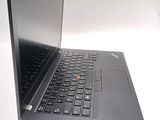 a laptop with a black keyboard on a white surface
