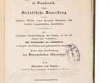 an old book with a stamp on it sitting on top of a table