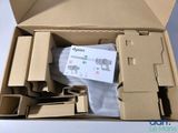 a cardboard box containing a pair of scissors and a pair of socks
