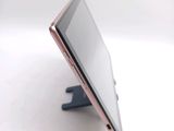 a close up of a cell phone on a stand