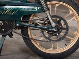 a close up of a motorcycle with a chain attached to it
