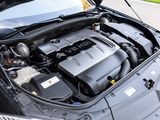the engine of a car with its hood open on the street