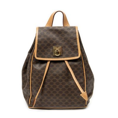 a brown and tan backpack with a brown handle