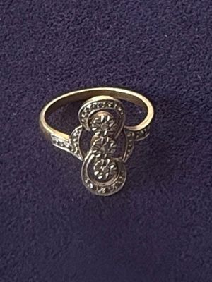 an image of a gold ring with diamonds on it
