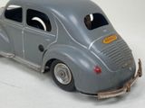 a toy car with a trailer attached to it