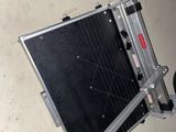 a black and silver case sitting on top of a table