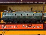 a toy train sitting on top of a yellow box