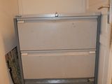 a refrigerator in the corner of a room with a tiled floor