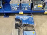 many different types of batteries on display in a store
