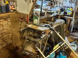 a room with a lot of clutter and tools in it
