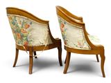 pair of chairs with floral upholstered back and arms