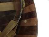 a close up of a military hat with a visor