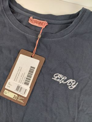 a grey t shirt with a tag on it that says keep it
