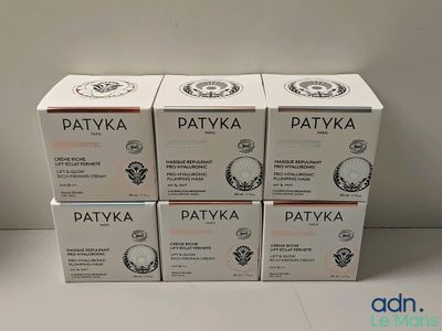 quatre boîtes de crème Patyka empilées les unes sur les autres