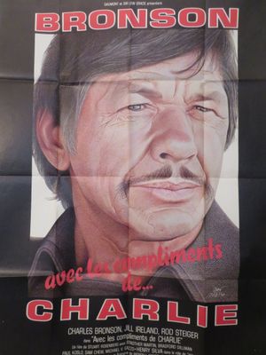 une affiche de cinéma représentant un homme moustachu sur fond noir