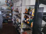 a man that is standing in a store looking at the shelves