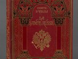 un livre rouge avec des inscriptions dorées et noires