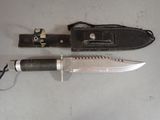 a knife that is laying on a table next to a knife