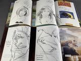 sketches of a book with a picture of a woman and a train