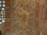 a lot of different rugs on display in a room