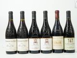 six bouteilles de vin sont alignées sur une surface blanche