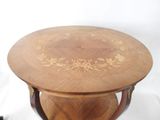 a wooden table with a decorative design on top of it
