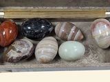 a box with a variety of stones inside of it
