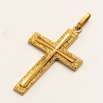 l'image d'une croix dorée sur un fond blanc