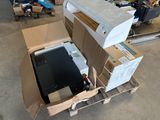 a box with a computer inside of it on a pallet