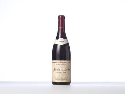 a bottle of wine that is sitting on a table