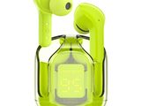 a close up of a green alarm clock with a pair of earphones