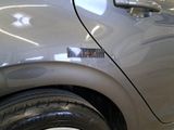a close up of a car door with a sticker on it